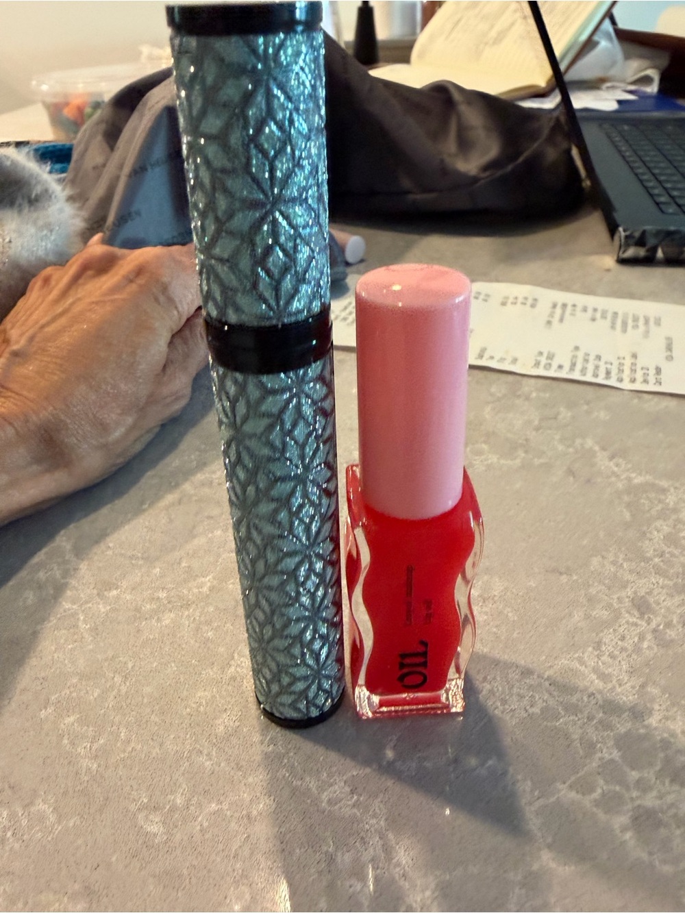 Black mascara and lip oil